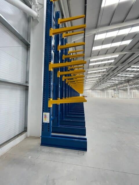 S.E.M.CO Single Sided Cantilever Racking being installed in a customer's warehouse space.