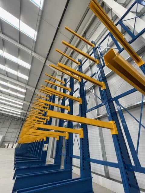 S.E.M.CO Single Sided Cantilever Racking being installed in a customer's warehouse space.