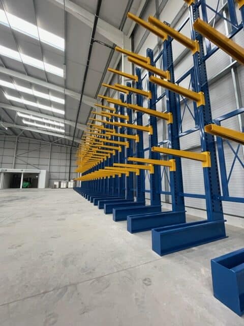 S.E.M.CO Single Sided Cantilever Racking being installed in a customer's warehouse space.